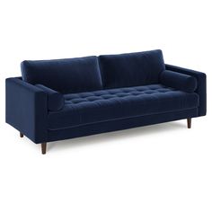 a blue couch sitting on top of a white floor