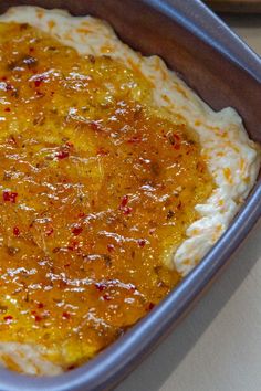 a casserole dish with cheese and other toppings