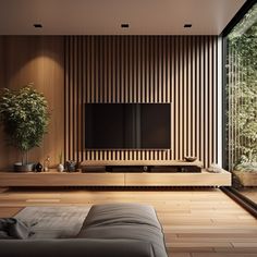 a modern living room with wood paneling and large tv on the wall, in front of a sliding glass door