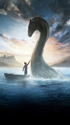 a man standing on top of a boat in the ocean next to a giant dragon