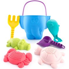 four plastic toys in the shape of sea animals and crab, including a watering can