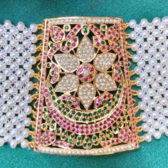 "Traditional punjabi jadau bracelet called \"Baahi\" in 92.5 gold plated silver. All pearls used are freshwater pearls. The stones. in setting are synthetic rubies and emeralds of high quality. Weight 38.5 GMs Height 5.5 cm Length 15 cm" Jadau Bracelet, 22k Gold Jewelry Necklaces, 22k Gold Jewelry, Pearl Necklace Set, Gold Jewelry Necklace, Gold Bangle Bracelet, Gold Plated Silver, Gold Plated Jewelry, Pearl Pendant