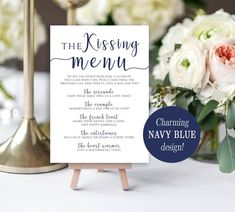 a table with flowers and a sign that says, the blessing menu for navy blue design