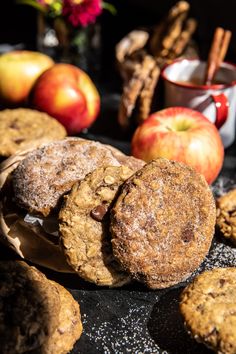 cookies, apples and cinnamon sticks on a table