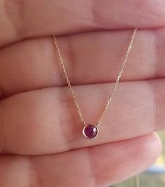 14K SOLID YELLOW GOLD BEZEL 0.20 CARAT RUBY SOLITAIRE NECKLACE Here is a dainty, delicate and simple, yet classy minimalist Bezel Ruby Solitaire Necklace. This is 14k Solid Gold. (We do not sell filled or plated jewelry) Perfect for everyday use. Metal : 14K Solid Gold Necklace Length : 16 inches / 41.5cm Pendant Height : 3.65mm Pendant Width : 3.65mm Ruby : 1 Natural Ruby Total Carat: 0.20ct ---MADE IN USA--- ---Absolutely stunning. Comes in a gift box. ---Shipping Policy---- Item will be shipp Gold Ruby Necklace, Solid Gold Necklace, Ruby Necklace, Solitaire Necklaces, July Birthstone, Natural Ruby, Jewelry Plate, Ruby, Solid Gold