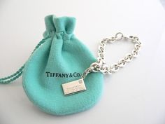 Offered for sale is a wonderful Tiffany and Co. Silver & "Sparkling" Diamond Envelope Charm bracelet.   The piece is made from substantial and bright Tiffany silver, and yet retains a very feminine feel to it.  Attached to its very substantial Tiffany Silver charm bracelet is a fantastic Envelope charm, accented with a gorgeous sparkling diamond.  The charm is attached to the bracelet with a Sterling Silver Tiffany Clasp - this clasp opens and closes and thus can be used as a charm on a ne Designer Silver Chain Bracelet For Gift, Designer Silver Chain Bracelet As Gift, Luxury Chain Bracelet With Sterling Silver Clasp As Gift, Aaa Quality Silver Bracelet For Wedding, Luxury Sterling Silver Chain Bracelet As Gift, Designer Sterling Silver Bracelet For Gift, Designer Sterling Silver Bracelet As Gift, Luxury Sterling Silver Jubilee Bracelet As Gift, Elegant Silver Bracelet With Hallmarks