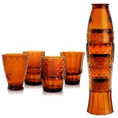 an assortment of orange glass vases and glasses