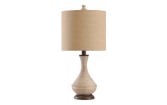 a table lamp with a beige shade on it and a brown base, sitting against a white background