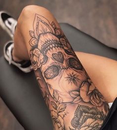 a woman's leg with a tattoo on it