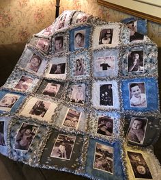 a quilt made with old photos is displayed on a couch in front of a lamp