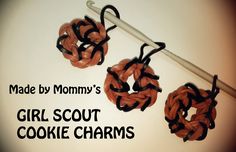 there are two crocheted pieces of yarn on top of a knitting hook with the words made by mommy's girl scout cookie charms