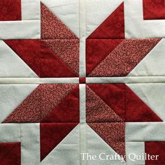 two red and white quilts on top of each other, one with an arrow