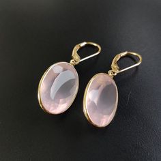 ITEM DESCRIPTION: >> The earrings are made from Solid 14K Yellow Gold. Gemstone used is absolutely natural and ethically sourced. >> Natural Rose Quartz in oval shape and bezel setting is studded on it with utmost precision with Lever back closure. >> This is a minimalist design and is absolutely hassle-free and everyday jewelry. Gem: Rose Quartz Gem size: 13x18 mm Gem weight: 26.65 carats Gold purity: 14K (58.33% approx.) Gold weight: 1.33 grams Gross weight: 6.66 grams The Gold purity is guara Luxury Rose Gold Oval Earrings, Pink Formal Hoop Earrings In Fine Jewelry Style, Pink Hoop Earrings For Formal Occasions, Pink Round Hoop Earrings For Formal Occasions, Pink Round Hoop Earrings For Formal Events, Classic Rose Gold Gemstone Earrings, Rose Gold Oval Earrings For Anniversary, Elegant Pink Gold Hoop Earrings, Faceted Yellow Gold Oval Earrings