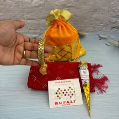 Indulge in tradition and luxury with our Varalakshmi Vratham Dupatta Gift Hamper. This exclusive gift set includes a beautiful velvet potli bag, a intricately designed dupatta, a fragrant mehndi cone, and stunning bangles. Perfect for Navaratri, Teej, Karva Chauth, or housewarming returns, this hamper is sure to impress and delight. Package Information - There are 3 variations. If you'd like to order in bulk you can also choose the quantity from the drop-down menu, you can select the one that be Kanya Pujan, Housewarming Return Gifts, Rakhi Greetings, Mehndi Cone, Varalakshmi Vratham, Bangle Ceremony, Holi Gift, Diwali Gift Hampers, Acrylic Rangoli