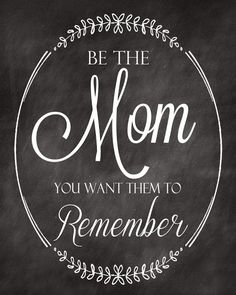 a chalkboard with the words be the mom you want to remember