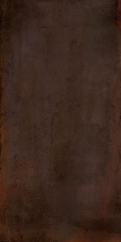 an orange and brown background with some black spots on it's edges, in the center is a square shaped object that appears to have been made out of rusted metal