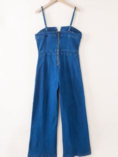 Blue Spaghetti Straps Notch V Denim Jumpsuit Make a statement with the Blue Spaghetti Straps Notch V Denim Jumpsuit, the latest elegant addition to your wardrobe. Crafted from a blend of 71% cotton, 27.5% polyester, and 1.5% elastane, this solid blue jumpsuit is perfect for daily wear during the summer season. Key Features: Straight neckline with a notched V detail Adjustable spaghetti straps for a customizable fit Flared legs for a chic and stylish look Seam decors and back zipper closure for a Chic Blue V-neck Denim Jumpsuit, Summer High-waist Denim Blue Jumpsuit, Summer High Waist Denim Blue Jumpsuit, Summer High Waist Denim Jumpsuit, High Waist Denim Blue Jumpsuit For Summer, Summer Denim Blue V-neck Jumpsuit, Denim Blue V-neck Jumpsuit For Summer, Fitted V-neck Denim Jumpsuit For Summer, Summer Denim V-neck Jumpsuit With Pockets