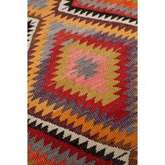 a multicolored area rug with an intricate design on the top and bottom corner