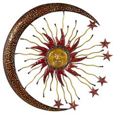 a metal sun and moon with stars around it