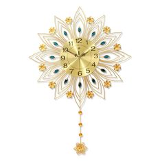 a gold clock with blue and white flowers on it