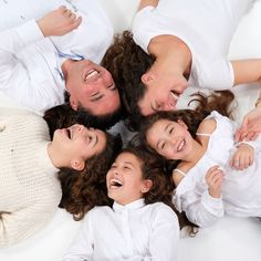 a group of people laying on top of each other in the middle of a circle