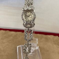 Vintage Stunning 1950's Bucherer Ladies Wrist Swiss Peak-A-Boo Watch from .800 Swiss Euro Silver and Marcasite Settings with Safety Chain This beautiful ladies wristwatch is in Excellent vintage condition. All the stones are intact, it winds and runs. It's extra nice 6.25 inches in length 3/4 inch diameter Silver Case Rare in this running condition shipping included The mineral marcasite, sometimes called white iron pyrite, is iron sulfide with orthorhombic crystal structure. It is physically an Antique Diamond Watch For Evening, Wedding Jewelry And Watches With 17 Jewels Round Dial, Timeless Wedding Jewelry With Clasp, Vintage Diamond Watch For Evening, Vintage Watches With Polished Finish For Evening, Vintage Diamond Watch With Diamond Hour Markers For Evening, Antique Hallmarked Watches For Wedding, Vintage Formal Bracelet With Box Clasp, Vintage Watches With Diamond Hour Markers