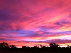 the sky is pink and purple as it appears to be very colorful in this photo