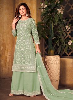 Pista Green Embroidered Palazzo Suit Shop Designer Indian & Pakistani Salwar Kameez Online In USA UK Canada With Free Shipping Worldwide. what fashionable women would love to flaunt. Showcasing a beautiful top enticing zari and cording thread embroidery work on soft net fabric that has beautiful traditional details paired with solid santoon palazzo bottom with minimalist work and inner. The beauty part is its butti and border embellished soft net dupatta. Team it up with statement jewellery and Kameez With Plazo, Plazo Dress, Long Blouses, Indian Dresses For Women, Trendy Stuff, Nikah Dress, Top Net, Modest Evening Dress, Palazzo Suit