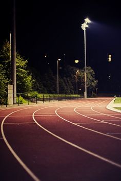 an image of a track at night with a quote on it that says, be it as a therapy i do it as something to keep me alive