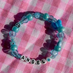 a bracelet that says angel on it