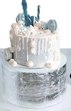 a white cake with frosting and decorations on it