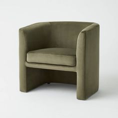 an olive green chair with curved legs