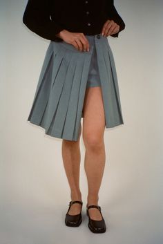 Gray Pleated Skort, Grey Pleated Short Skort, Spring Fitted Gray Tennis Skirt, Gray Pleated Skort Of Short Length, Gray Pleated Short Skirt, Gray Pleated Short Length Skort, Knee-length Fitted Shorts For Spring, Spring Knee-length Skirt With Built-in Shorts, Fitted Knee-length Shorts For Spring