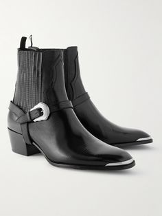 CELINE HOMME's Chelsea boots combine traditional Western style with its signature rock 'n' roll energy. This pair has been crafted in Italy from sleek lizard-effect leather and features silver-tone accents along the almond toes and buckles, simply remove the harness straps for a more streamlined look. Luxury Chelsea Boots With Rubber Sole For Derby, Luxury Leather Chelsea Boots With Buckle Closure, Luxury Cap Toe Chelsea Boots For Derby, Luxury Black Calf Leather Derby Shoes, Luxury Black Derby With Leather Sole, Harry Styles Chelsea Boots, Chelsea Boots For Men, Boots Outfit Men, Cowboy Shoes