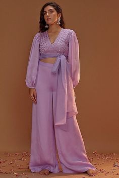 Lilac Satin Organza Palazzo Pant Set Featuring a lilac crop top in satin organza base. It is paired with matching palazzo pants and an organza tie-up. This product will be shipped to you after 1-2 weeks from the date of order placed. All custom made orders are not returnable. NOTE: Visual Samples on website may differ slightly from actual product due to light & effects during photography (Length & Breadth have 1 n 1.5 inches +/-). NOTE : Before placing order ,pls confirm product n color availability on +91 7903893945 & +91 8447750028(WhatsApp) NOTE : For Wholesale Order MOQ is 5 Pieces of any color/Pattern contact on +91 7903893945 & +91 8447750028(WhatsApp) Organza Palazzo, Lilac Crop Top, One Piece Gown, Evening Dress Wedding, Berry Dress, Gown With Dupatta, Dress Wedding Party, Zari Embroidery, Pink Peacock