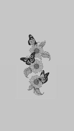 three butterflies flying over flowers on a gray background