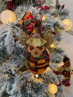 a decorated christmas tree with ornaments and lights on the branches, including a nutcracker ornament