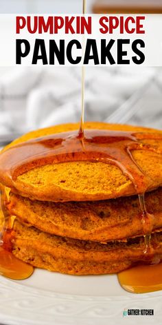 stack of pumpkin spice pancakes on a white plate with syrup drizzled over them