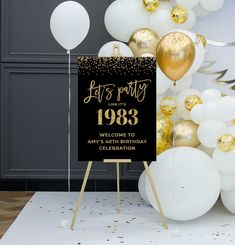 a party sign with balloons and streamers in the background