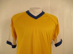 "Vintage 1970s sports style V neck t shirt. Made of perforated Nylon. Color is yellow with white and blue. No label. Size large. Actual measurements are: 40\" around the chest 40\" around the waist 17\" shoulder seam to shoulder seam 28.5\" overall length In very good condition." Cowgirl Skirt, Western Skirts, 1970s Dresses, Yellow Shirt, Plain T Shirt, Sports Shirt, Sports Style, Purple T Shirts, Hawaiian Dress