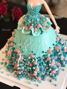 a cake made to look like a dress with flowers on it