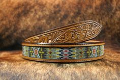 This belt is titled HH10, full beaded, hand tooled, natural color, also tooled on the inside, straight no taper, however you can select a taper for a smaller buckle set. Please list size and if you want a straight or tapered belt in the personalized section. We also have our siamese cat Joey as supervisor making sure we keep focused. NOTE: WE Have THIS BELT IN STOCK NOW AVAILABLE IN A SIZE 36 READY TO SHIP. Most of our belts are custom made to order. Traditional Adjustable Hand-tooled Belt, Beaded Belts, Beaded Belt, Bead Leather, Suspender Belt, Guitar Strap, Siamese Cats, Leather Belts, Western Style