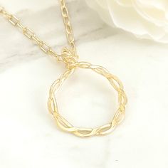 This is a lovely longer style necklace; it has a unique twisted circle pendant that was crafted using gold wire. The long chain consists of sturdy paper clip links - currently a very trendy choice. This necklace can also be a wonderful layering piece. Wearing one or two shorter gold necklaces with this longer one will surely give you a chic and polished look! MATERIALGold filled chainGold filled wireSIZE25-inch chain24mm circle pendantCLOSURELobster claspWHAT IS GOLD FILLED?We used to have just Gold Oval Pendant Necklace Wire Wrapped, Gold Necklace With Wire Wrapped Oval Pendant, Gold Wire Wrapped Necklace With Oval Pendant, Gold Wire Wrapped Oval Pendant Necklace, Everyday Gold Wire Wrapped Necklace, Elegant Wire Wrapped Chain Necklace, Short Gold Necklace, Circle Pendant Necklace, Gold Necklaces