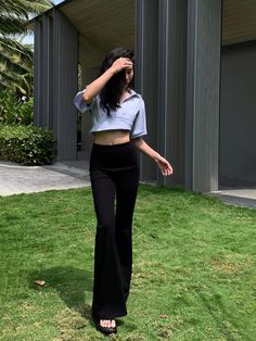 Meet the Black High-Waist Slimming Bell-Bottom Pants from our 2023 Summer Collection. These pants feature a flattering high waist and a slimming design, perfect for casual wear. The subtle flare at the bottom adds a stylish touch to your summer wardrobe. Stay fashionable and comfortable this season. Details Composition: 67% Viscose Fiber, 26% Nylon, 7% Spandex Design: Plain Style: Casual Thickness: Regular Occasion: Leisure Size & Fit Stretch: Some-stretch Fit Type: Shift Our model is 167 cm/5’5