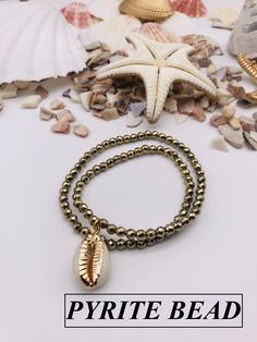 We launched to market recently and we want to reach more customers so we are offering promotional prices for our high quality, special design products for your valuable customers. * Sea shell bracelet made by natural cowrie shells and combined with natural stone bides. * Adjustable and elastic cord to fit all sizes for your comfort. a beautiful gift for your loved ones and fits. * Comes nicely wrapped in a jewelry box and ready to be gifted. For the gift purchases please inform us and gift packa Gold Spiritual Stretch Bracelet For Beach, Sea Shell Bracelet, Cowrie Shell Bracelet, Bracelet Star, Bracelet Evil Eye, Mothers Bracelet, Cowrie Shells, How To Clean Metal, Shell Bracelet