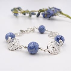 Handmade dried flower bracelet made with wedding or funeral flowers Dried Petals, Beautiful Compliments, Memorial Flowers, Wrought Iron Gates, Sterling Silver Charms, Iron Gates, Elegant Bracelet, Charleston South Carolina, Sterling Silver Charm