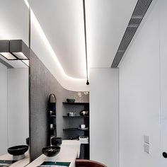 a modern bathroom with black and white decor