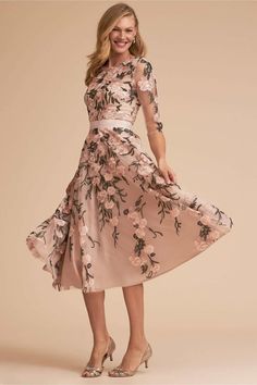 the dress is for sale and it has an image of a woman in floral print