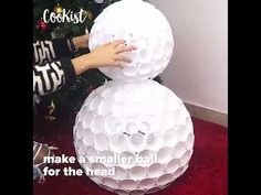 someone is building a snowman out of toilet paper