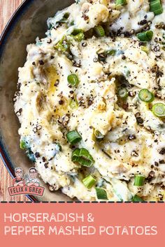 a bowl filled with mashed potatoes on top of a wooden table